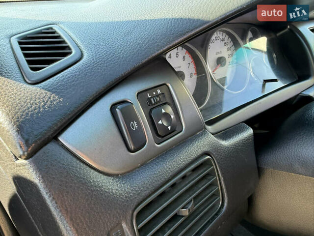 Синій Міцубісі Lancer, об'ємом двигуна 1.58 л та пробігом 269 тис. км за 3350 $, фото 14 на Automoto.ua