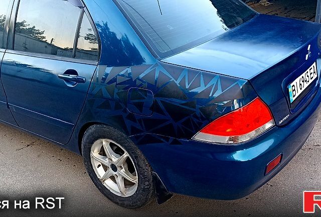 Синий Мицубиси Лансер, объемом двигателя 1.6 л и пробегом 305 тыс. км за 3500 $, фото 7 на Automoto.ua