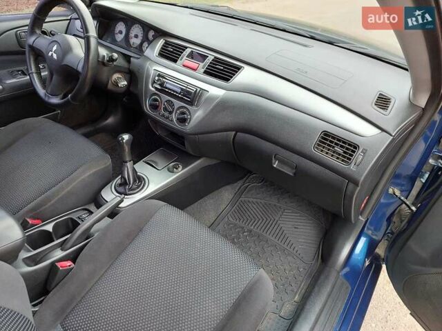 Синий Мицубиси Лансер, объемом двигателя 1.6 л и пробегом 222 тыс. км за 4599 $, фото 11 на Automoto.ua