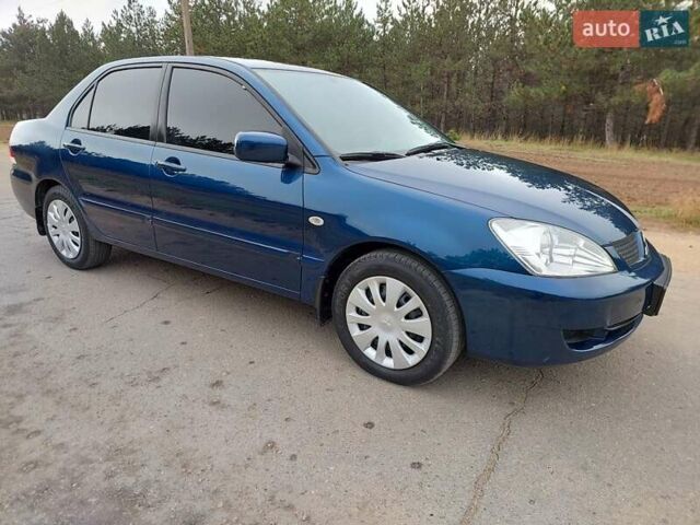 Синий Мицубиси Лансер, объемом двигателя 1.6 л и пробегом 222 тыс. км за 4599 $, фото 3 на Automoto.ua