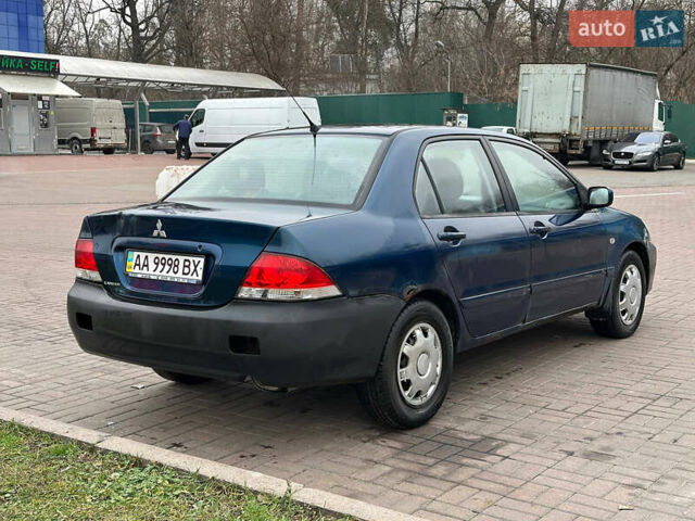 Синий Мицубиси Лансер, объемом двигателя 1.58 л и пробегом 260 тыс. км за 2300 $, фото 3 на Automoto.ua
