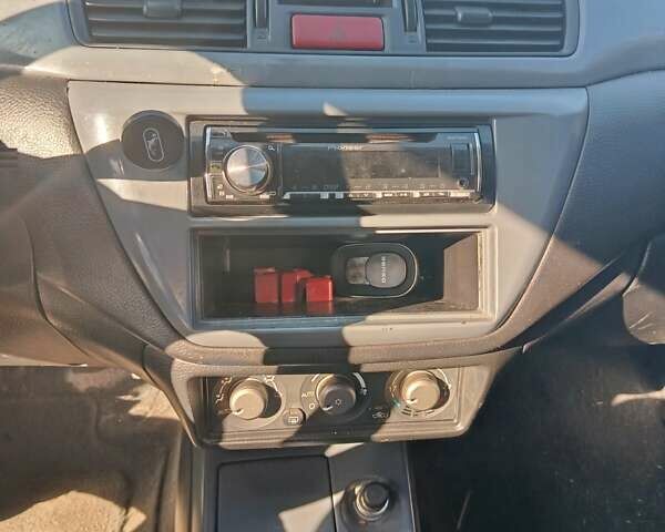 Синий Мицубиси Лансер, объемом двигателя 1.58 л и пробегом 274 тыс. км за 2650 $, фото 8 на Automoto.ua