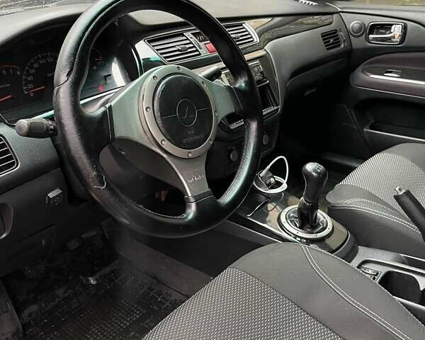Синій Міцубісі Lancer, об'ємом двигуна 2 л та пробігом 430 тис. км за 4200 $, фото 2 на Automoto.ua