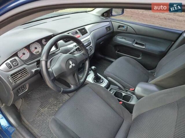 Синий Мицубиси Лансер, объемом двигателя 1.6 л и пробегом 222 тыс. км за 4599 $, фото 10 на Automoto.ua