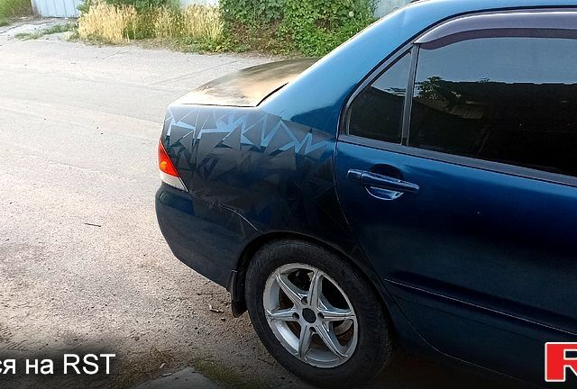 Синий Мицубиси Лансер, объемом двигателя 1.6 л и пробегом 305 тыс. км за 3500 $, фото 5 на Automoto.ua