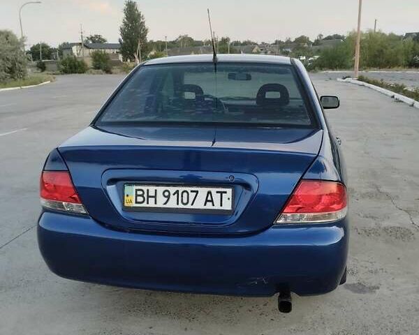 Синий Мицубиси Лансер, объемом двигателя 1.6 л и пробегом 263 тыс. км за 3400 $, фото 2 на Automoto.ua