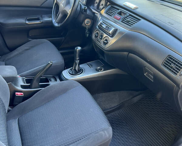 Міцубісі Lancer 2006 у Дніпро (Дніпропетровську) на Automoto.ua Синій Міцубісі Lancer, об'ємом двигуна 1.58 л та пробігом 284 тис. км за 4500 $, фото 11 на Automoto.ua