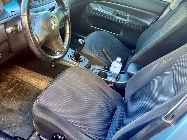 Синій Міцубісі Lancer, об'ємом двигуна 1.6 л та пробігом 273 тис. км за 3499 $, фото 4 на Automoto.ua