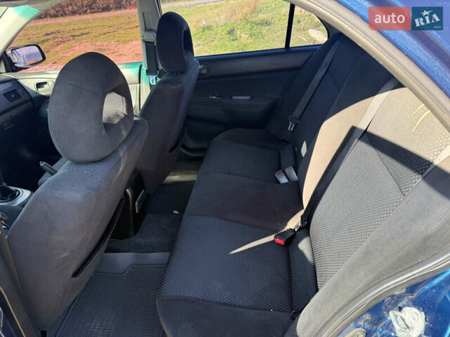 Синій Міцубісі Lancer, об'ємом двигуна 1.58 л та пробігом 269 тис. км за 3350 $, фото 16 на Automoto.ua