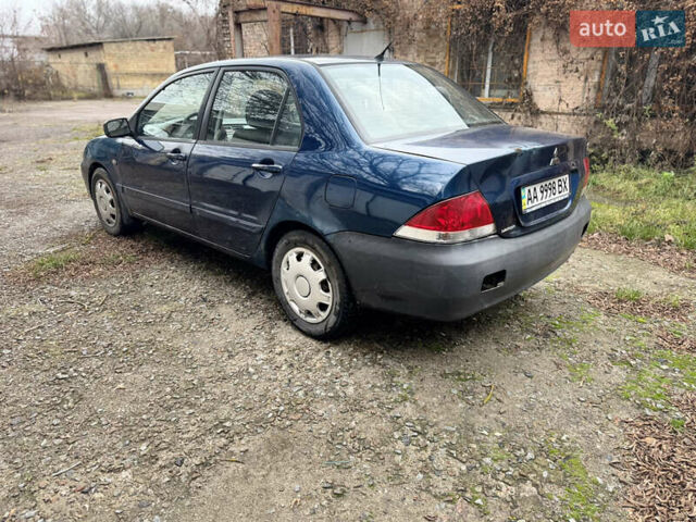 Синий Мицубиси Лансер, объемом двигателя 1.58 л и пробегом 243 тыс. км за 2900 $, фото 7 на Automoto.ua