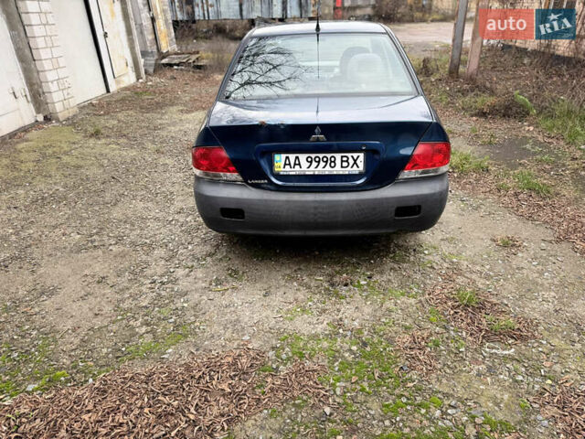 Синий Мицубиси Лансер, объемом двигателя 1.58 л и пробегом 243 тыс. км за 2900 $, фото 6 на Automoto.ua