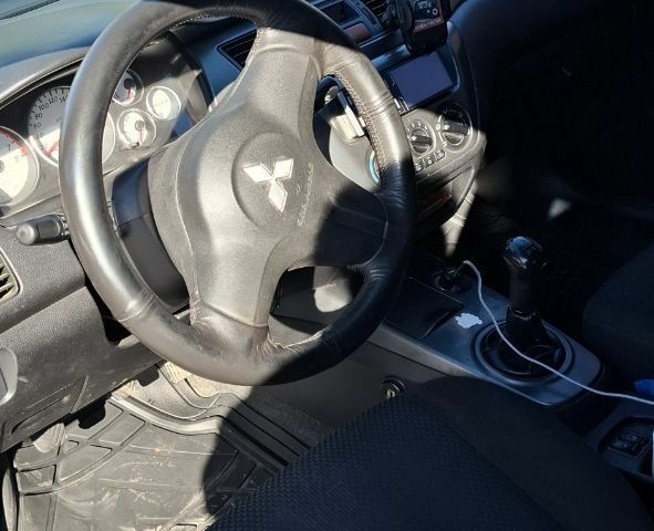 Синій Міцубісі Lancer, об'ємом двигуна 1.6 л та пробігом 267 тис. км за 3700 $, фото 9 на Automoto.ua