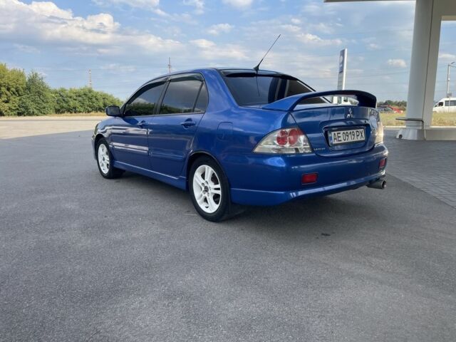 Синій Міцубісі Lancer, об'ємом двигуна 2 л та пробігом 300 тис. км за 4400 $, фото 3 на Automoto.ua