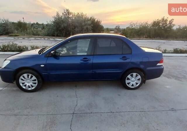 Синий Мицубиси Лансер, объемом двигателя 1.6 л и пробегом 263 тыс. км за 3400 $, фото 5 на Automoto.ua