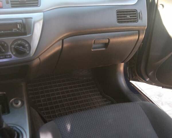 Синий Мицубиси Лансер, объемом двигателя 1.58 л и пробегом 195 тыс. км за 3990 $, фото 19 на Automoto.ua