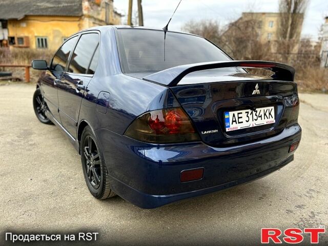 Синій Міцубісі Lancer, об'ємом двигуна 2 л та пробігом 225 тис. км за 5950 $, фото 4 на Automoto.ua