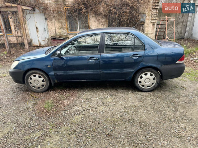 Синий Мицубиси Лансер, объемом двигателя 1.58 л и пробегом 243 тыс. км за 2900 $, фото 8 на Automoto.ua
