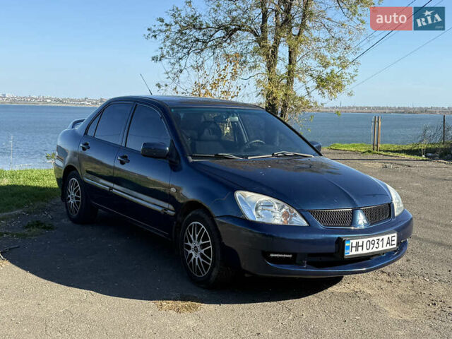 Синій Міцубісі Lancer, об'ємом двигуна 1.58 л та пробігом 269 тис. км за 3350 $, фото 2 на Automoto.ua