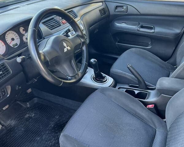 Міцубісі Lancer 2006 у Дніпро (Дніпропетровську) на Automoto.ua Синій Міцубісі Lancer, об'ємом двигуна 1.58 л та пробігом 284 тис. км за 4500 $, фото 8 на Automoto.ua