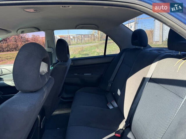 Синій Міцубісі Lancer, об'ємом двигуна 1.58 л та пробігом 269 тис. км за 3350 $, фото 17 на Automoto.ua