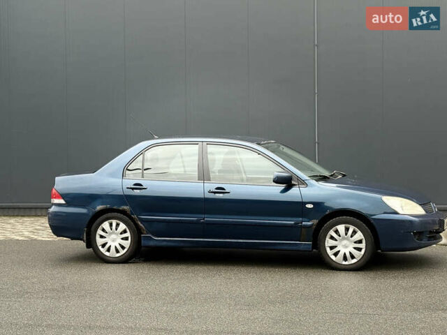 Синій Міцубісі Lancer, об'ємом двигуна 1.58 л та пробігом 513 тис. км за 2500 $, фото 8 на Automoto.ua