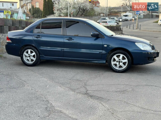 Синий Мицубиси Лансер, объемом двигателя 1.58 л и пробегом 300 тыс. км за 3650 $, фото 4 на Automoto.ua