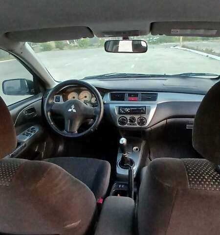 Синий Мицубиси Лансер, объемом двигателя 1.6 л и пробегом 263 тыс. км за 3400 $, фото 6 на Automoto.ua