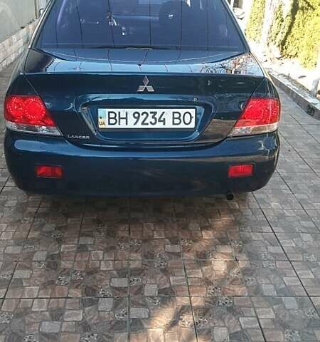Синий Мицубиси Лансер, объемом двигателя 1.58 л и пробегом 195 тыс. км за 3990 $, фото 27 на Automoto.ua
