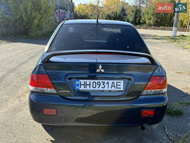 Синій Міцубісі Lancer, об'ємом двигуна 1.58 л та пробігом 269 тис. км за 3350 $, фото 6 на Automoto.ua