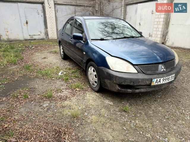Синий Мицубиси Лансер, объемом двигателя 1.58 л и пробегом 243 тыс. км за 2900 $, фото 3 на Automoto.ua