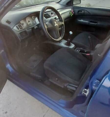 Синий Мицубиси Лансер, объемом двигателя 1.6 л и пробегом 263 тыс. км за 3400 $, фото 9 на Automoto.ua