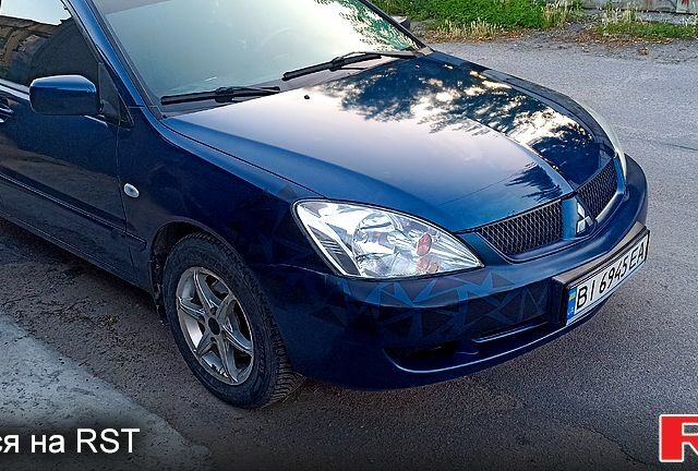 Синий Мицубиси Лансер, объемом двигателя 1.6 л и пробегом 305 тыс. км за 3500 $, фото 6 на Automoto.ua