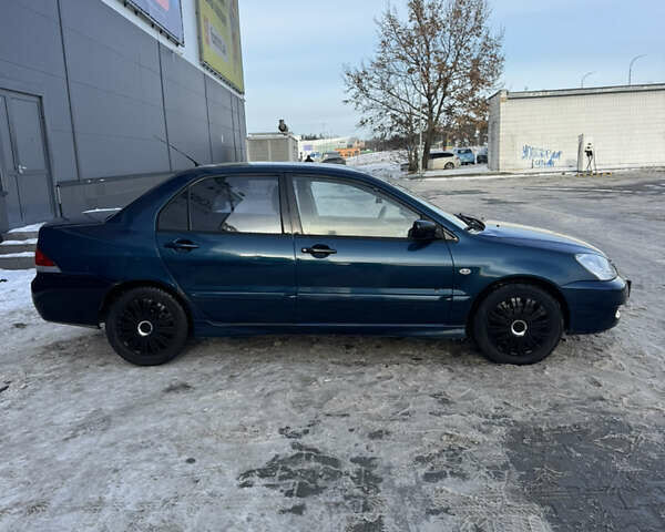 Синий Мицубиси Лансер, объемом двигателя 1.58 л и пробегом 244 тыс. км за 3300 $, фото 4 на Automoto.ua