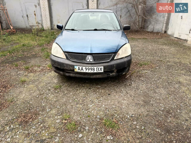 Синий Мицубиси Лансер, объемом двигателя 1.58 л и пробегом 243 тыс. км за 2900 $, фото 2 на Automoto.ua