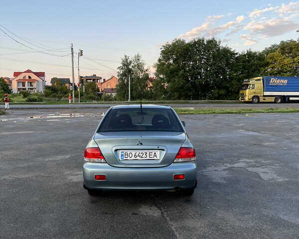 Синій Міцубісі Lancer, об'ємом двигуна 1.6 л та пробігом 237 тис. км за 4099 $, фото 5 на Automoto.ua