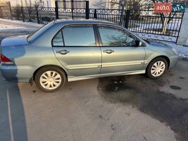 Синий Мицубиси Лансер, объемом двигателя 1.6 л и пробегом 172 тыс. км за 5900 $, фото 1 на Automoto.ua