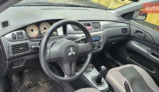 Синий Мицубиси Лансер, объемом двигателя 1.62 л и пробегом 114 тыс. км за 5200 $, фото 8 на Automoto.ua