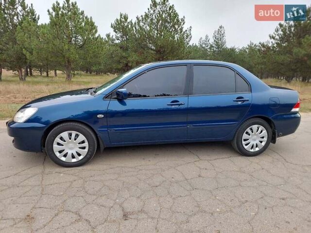 Синий Мицубиси Лансер, объемом двигателя 1.6 л и пробегом 222 тыс. км за 4599 $, фото 2 на Automoto.ua
