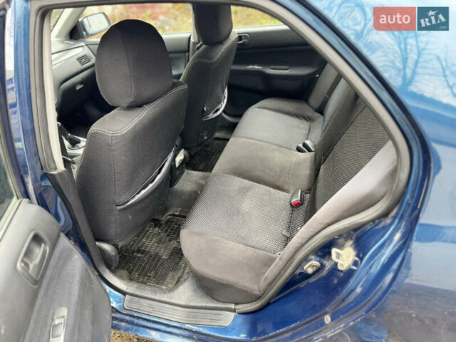 Синий Мицубиси Лансер, объемом двигателя 1.58 л и пробегом 243 тыс. км за 2900 $, фото 10 на Automoto.ua