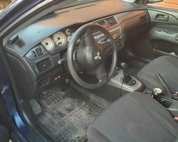 Синий Мицубиси Лансер, объемом двигателя 1.6 л и пробегом 360 тыс. км за 3000 $, фото 6 на Automoto.ua