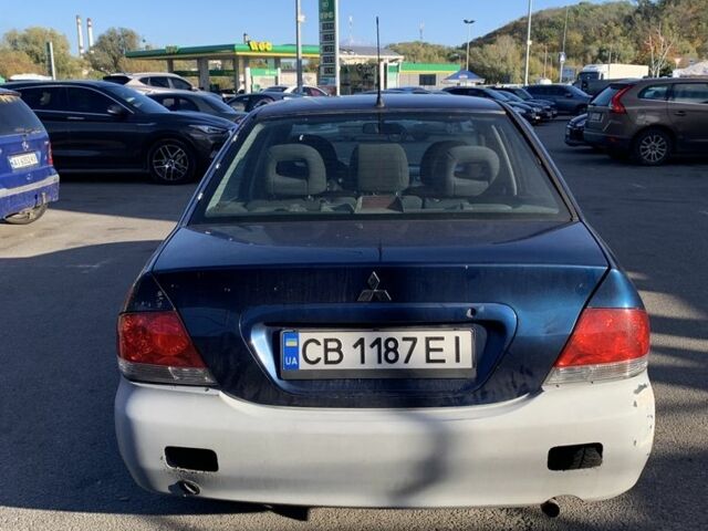 Синій Міцубісі Lancer, об'ємом двигуна 1.6 л та пробігом 242 тис. км за 2100 $, фото 4 на Automoto.ua