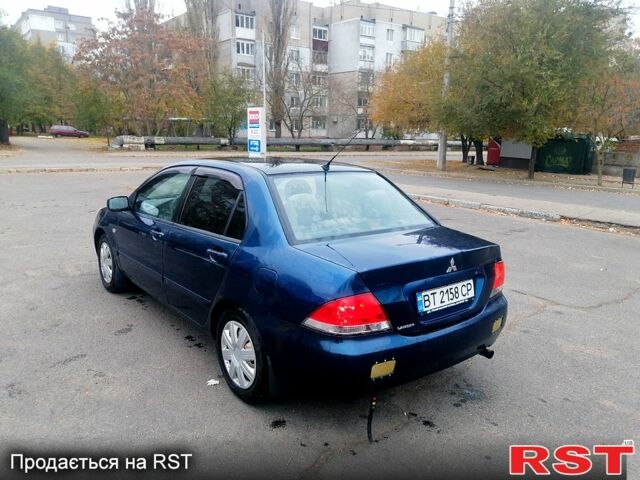 Синий Мицубиси Лансер, объемом двигателя 1.6 л и пробегом 258 тыс. км за 3400 $, фото 1 на Automoto.ua