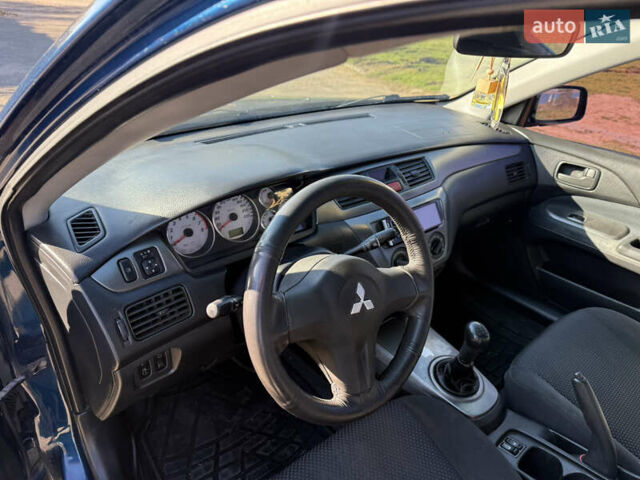 Синій Міцубісі Lancer, об'ємом двигуна 1.58 л та пробігом 269 тис. км за 3350 $, фото 7 на Automoto.ua