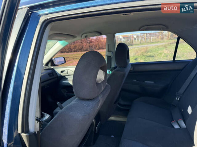 Синій Міцубісі Lancer, об'ємом двигуна 1.58 л та пробігом 269 тис. км за 3350 $, фото 18 на Automoto.ua