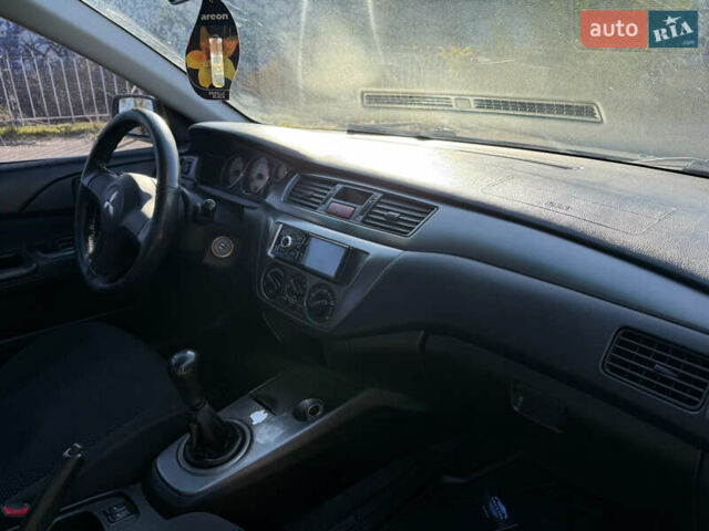 Синій Міцубісі Lancer, об'ємом двигуна 1.58 л та пробігом 269 тис. км за 3350 $, фото 23 на Automoto.ua