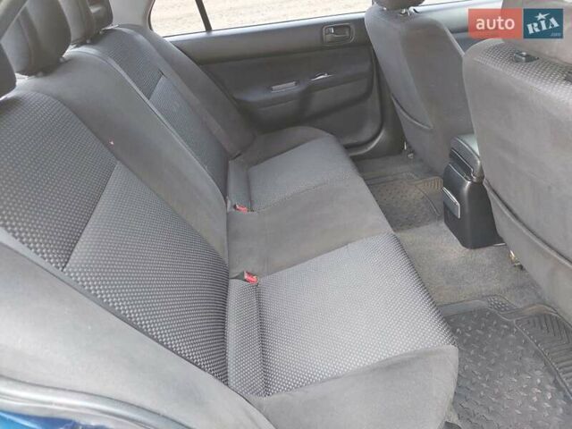 Синий Мицубиси Лансер, объемом двигателя 1.6 л и пробегом 222 тыс. км за 4599 $, фото 13 на Automoto.ua