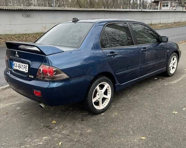 Синій Міцубісі Lancer, об'ємом двигуна 2 л та пробігом 430 тис. км за 4200 $, фото 1 на Automoto.ua