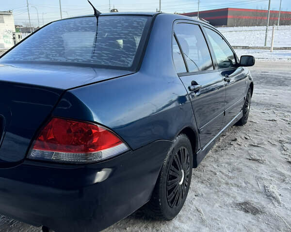 Синий Мицубиси Лансер, объемом двигателя 1.58 л и пробегом 244 тыс. км за 3300 $, фото 10 на Automoto.ua