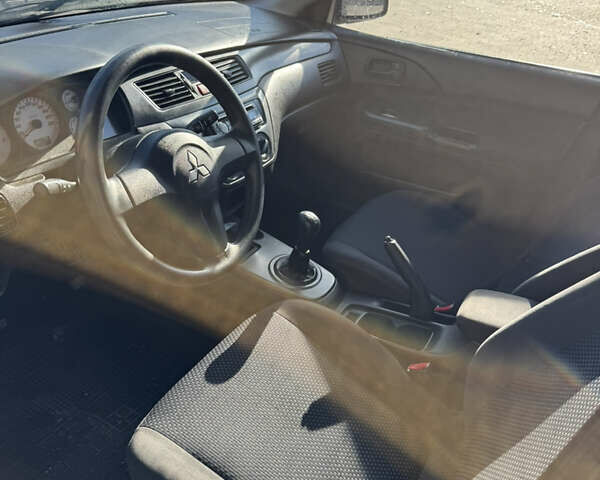 Синій Міцубісі Lancer, об'ємом двигуна 1.6 л та пробігом 148 тис. км за 3000 $, фото 13 на Automoto.ua