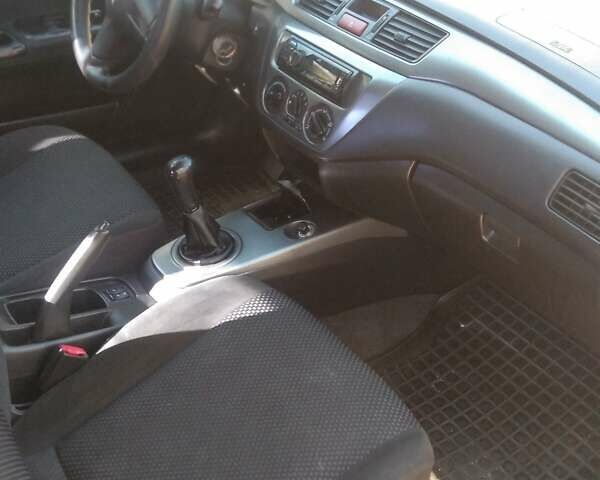 Синий Мицубиси Лансер, объемом двигателя 1.58 л и пробегом 195 тыс. км за 3990 $, фото 6 на Automoto.ua